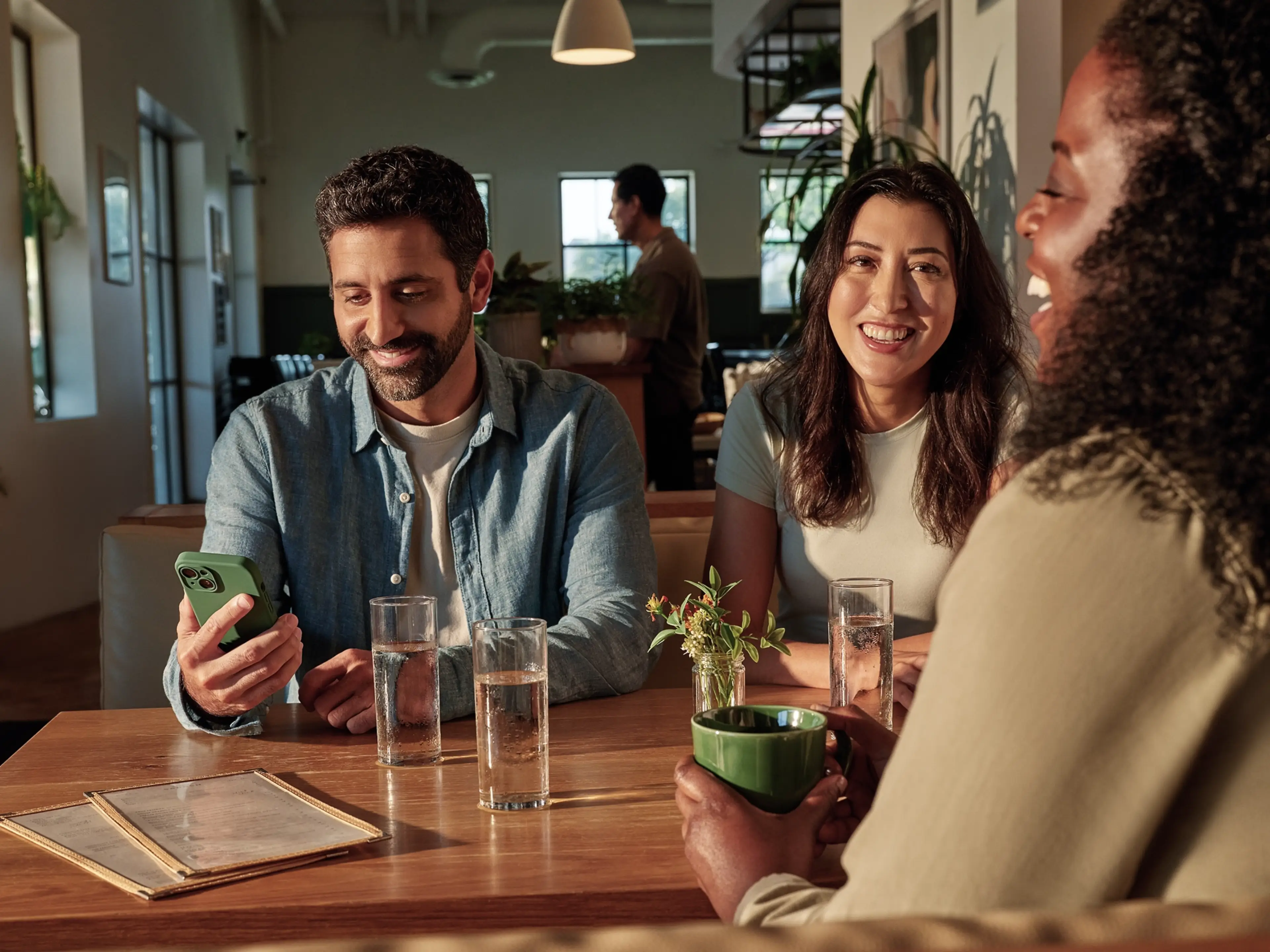 People gathered at a cafe table.
