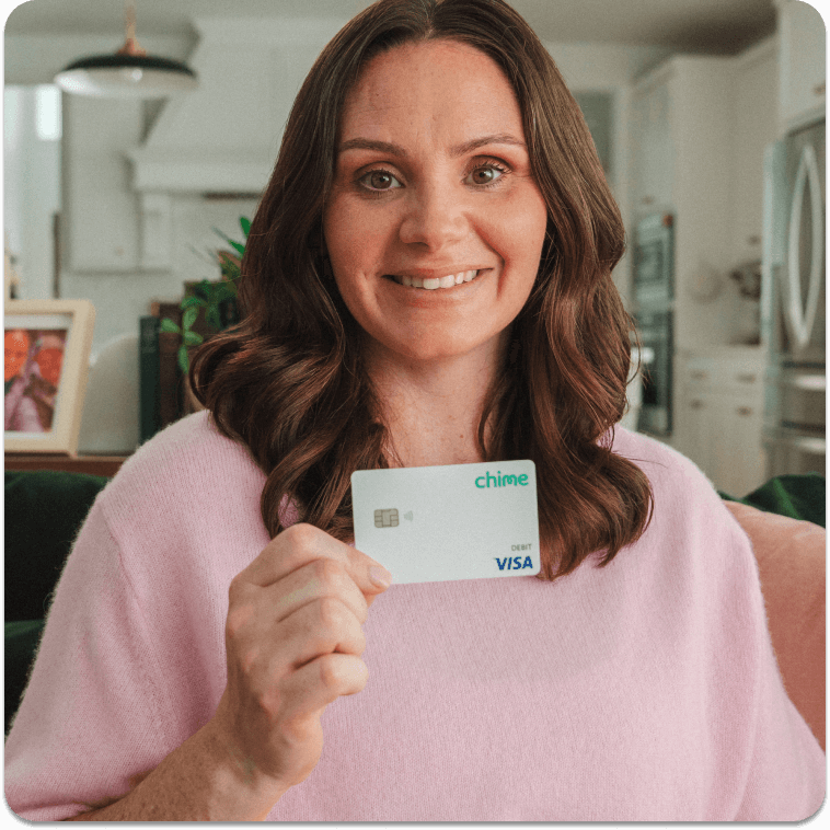 Ryan holds up her Chime card.