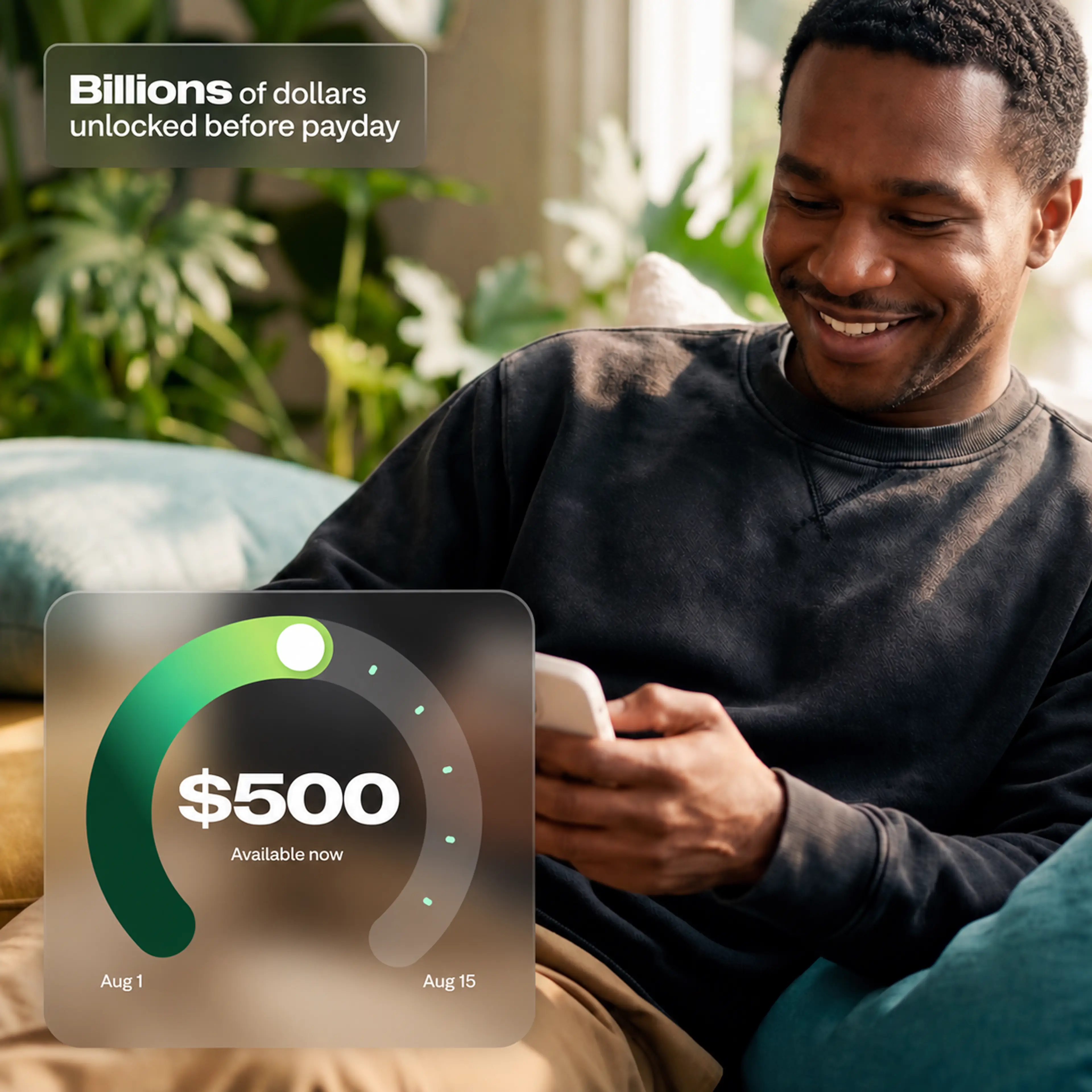 A smiling man on a couch uses his phone, with an app UI showing $500 available and text reading Billions of dollars unlocked before payday.