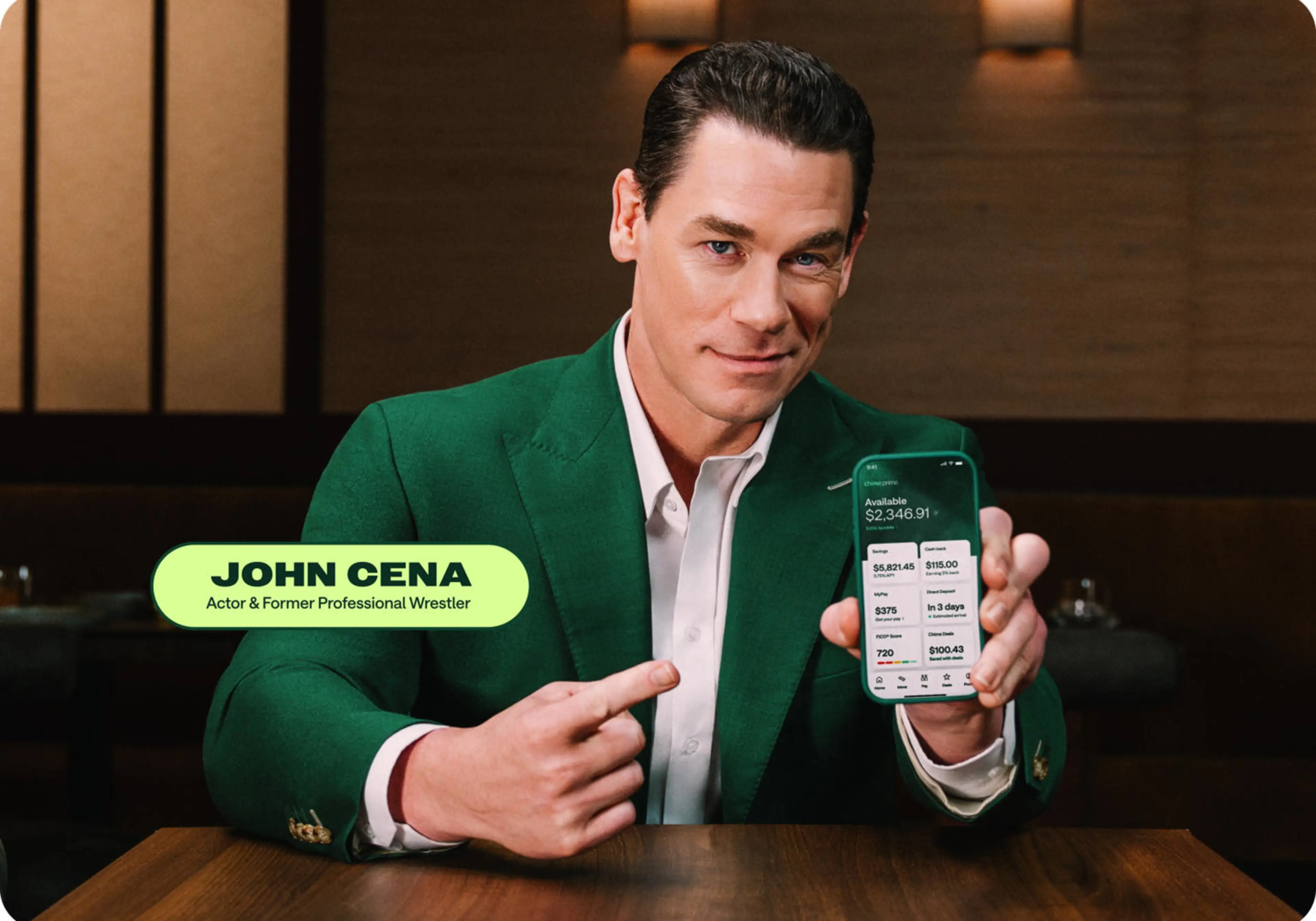 John Cena in a green blazer pointing at a Chime app on a smartphone, labeled Actor & Former Professional Wrestler.