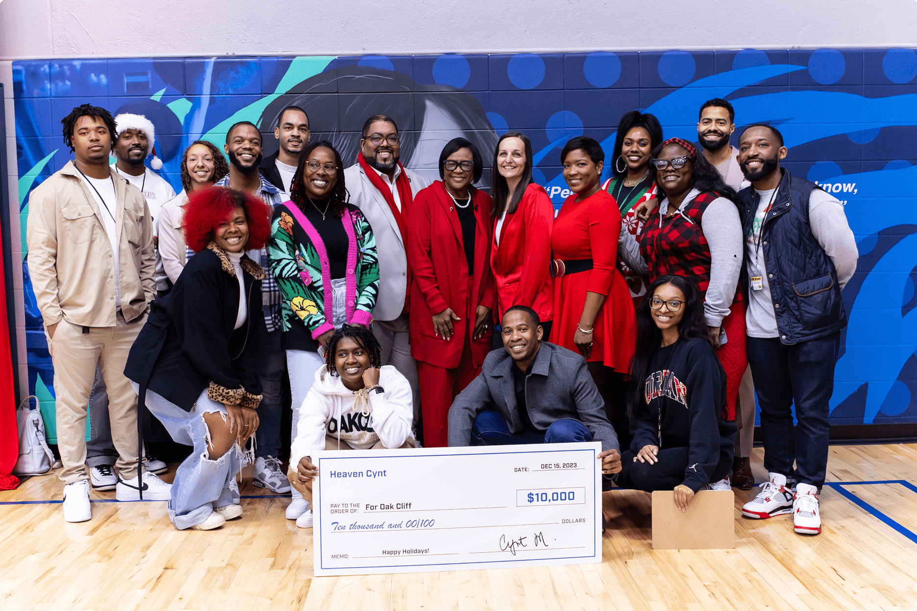 A group of Chime Community Changemakers surrounding a check.