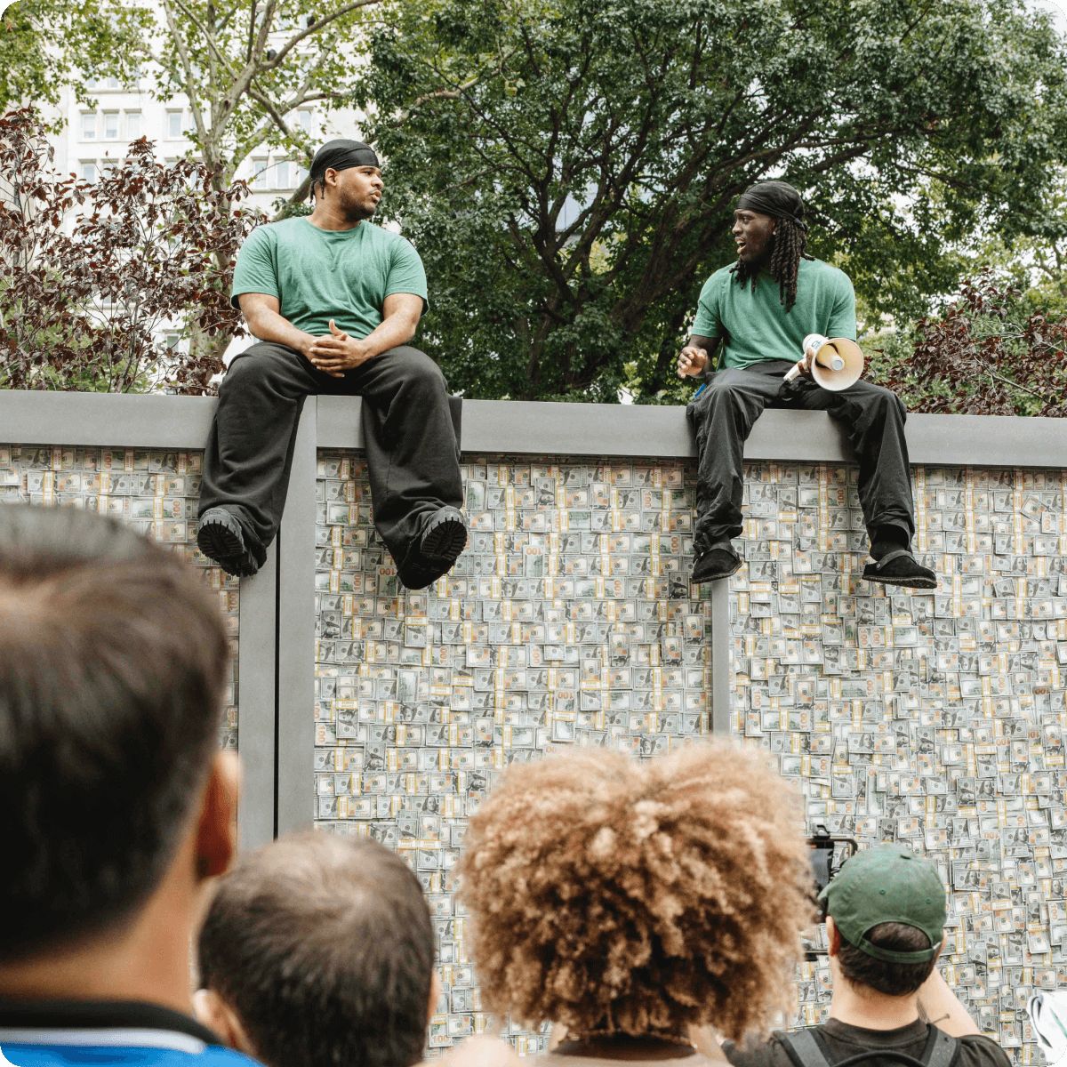 Kai and Funam sit on top of Chime's MyPay Vault truck and speak.