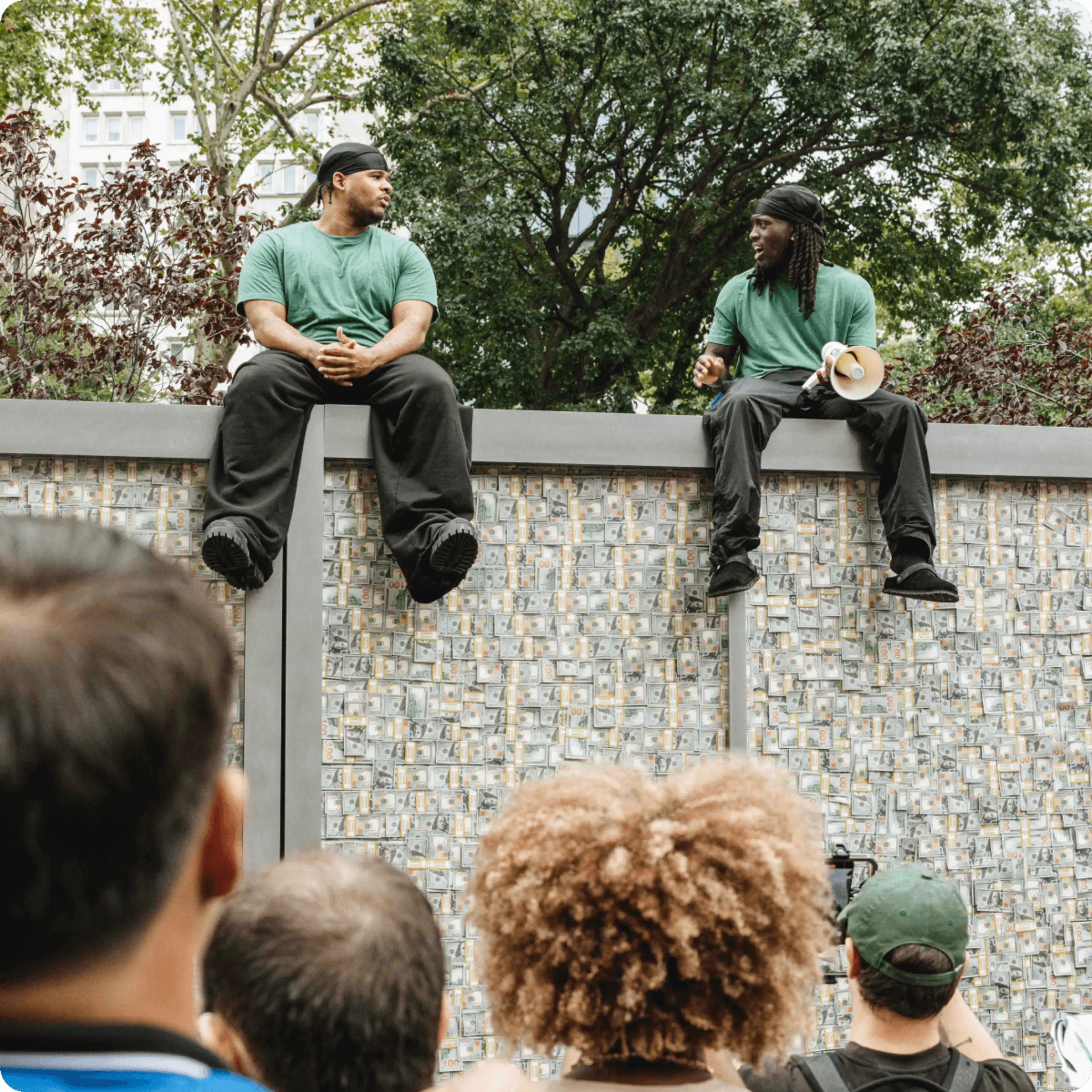 Kai and Funam sit on top of Chime's MyPay Vault truck and speak.